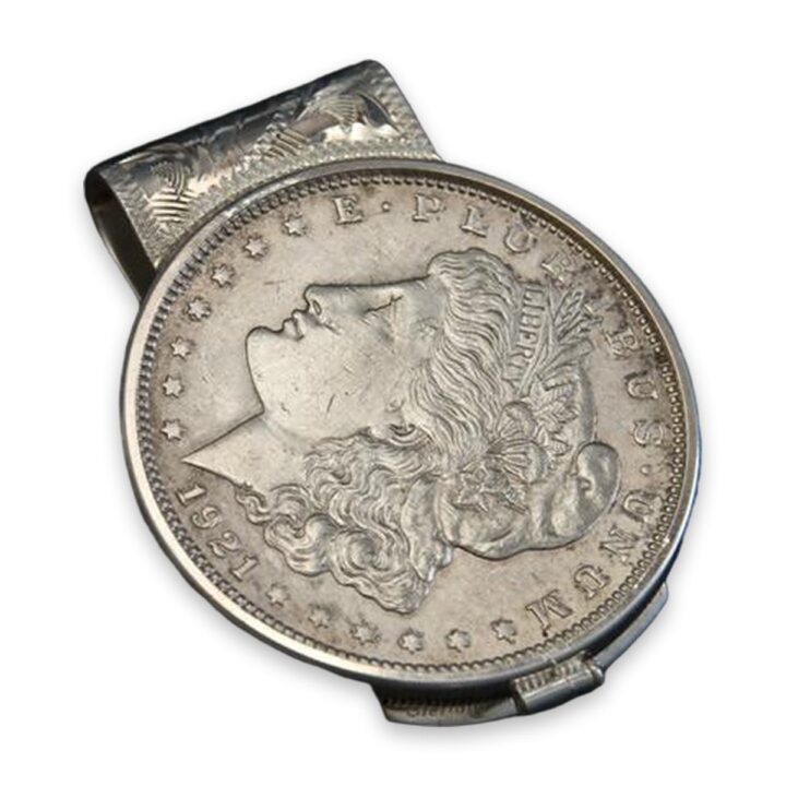 Hand engraved sterling silver money clip with Morgan silver dollar, on a white background