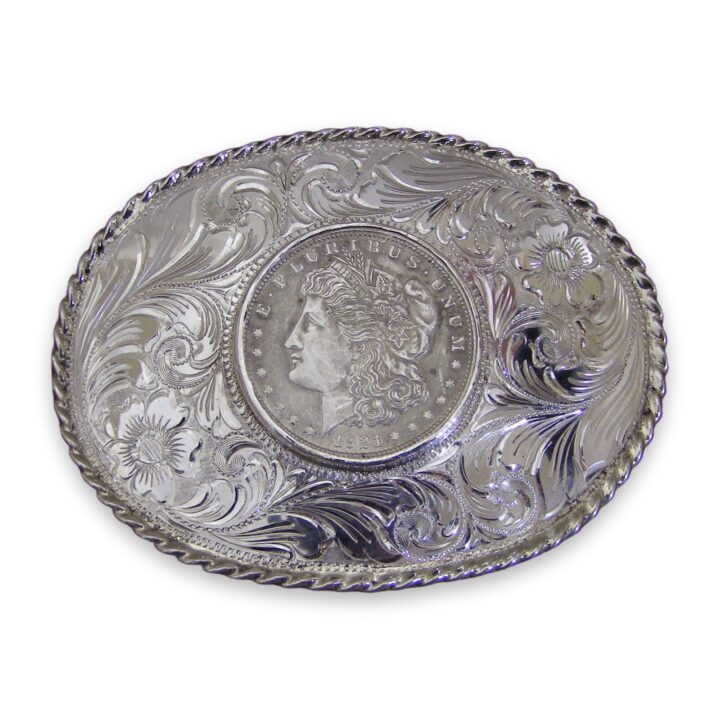 3 by 4 inch sterling silver oval trophy buckle with Morgan silver dollar, on a white background