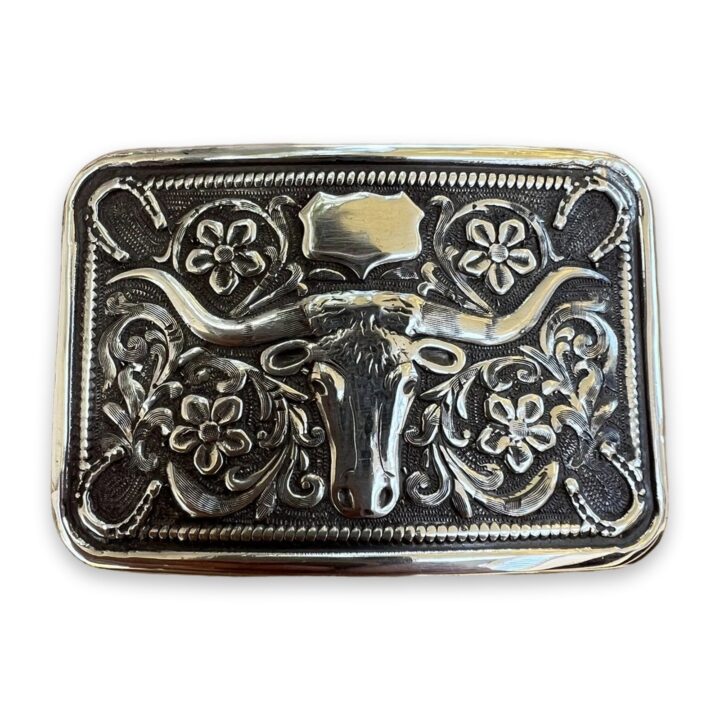 sterling silver steer head horseshoe trophy buckle on a white background
