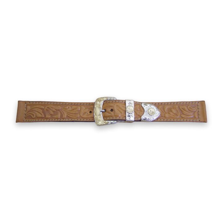 Tooled calf leather watch strap with hand engraved sterling silver and 10K gold buckle set, on a white background
